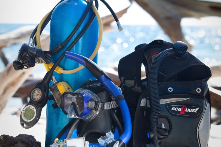 Scuba diving gear sitting on rock